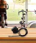 Fine Tuned Resistance Rotary Adjuster For Exercise Bike With Eight To Ten Gear System placed on a wooden table.
