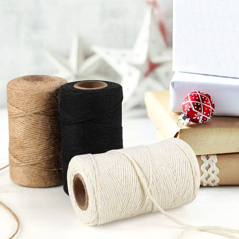 Three Rolls Of 984 Ft Twine String 2mm Natural Jute And White Cotton Rope For Crafts DIY Projects Gardening Gift Wrapping And Decoration Packing Bulk displayed with gift boxes.