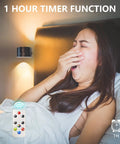 Woman yawning in bed with Up And Down LED Wall Sconce, remote control, showcasing 1-hour timer function.