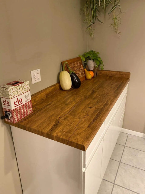 Wood Grain Peel And Stick Wallpaper For Countertops And Cabinets Waterproof Easy To Clean Self Adhesive Removable Vinyl Roll Rustic Brown Yellow 17.7 Inch Wide By 78.7 Inch Long DIY Friendly No Mess Kitchen Remodel covering a kitchen countertop with vegetables and plants.