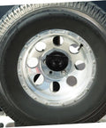 Spare Tire Bolt And Retainer Clamp For Cars And Trucks No-Fuss Easy Install Wheel Replacement Part Built Tough To Keep Your Spare From Bouncing And Rattling, close-up view of a secured tire on a vehicle.