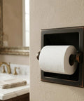 Oil Rubbed Bronze Recessed Toilet Paper Holder With All Metal Construction In Wall Mount Includes Mounting Bracket 6 Inch Wide By 6 Inch High Durable Finish Easy Install 15 Year Finish Warranty Recessed Design in bathroom setting.