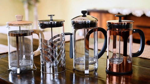 Four French press coffee makers, including a Natural Grain Glass And Bamboo 1 Liter French Press Coffee And Tea Maker With Removable Glass Carafe
