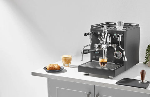 Alto Espresso Machine With Flow Control, Dual Boiler and PID for Precise Temperature in black, on kitchen counter with coffee.