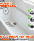 Universal Silicone Bathtub Drain Strainer With Tall Dome Design For Quick Shower Hair Catcher And Jewelry Protection No Sweat Setup Fits Standard US Sizes Like A Glove And Keeps Your Drains Clear in a white tub with hair and a drain cover.
