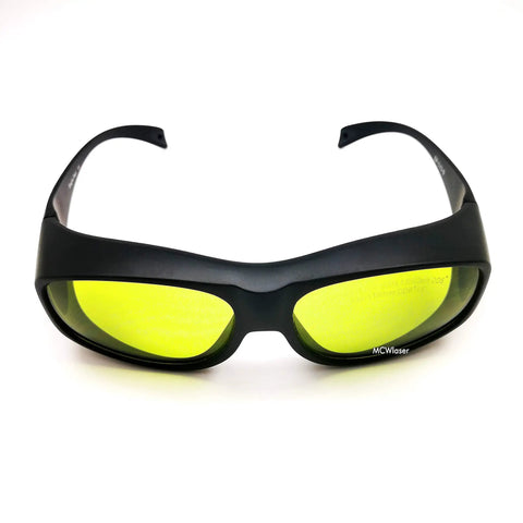 Heavy Duty Laser Safety Glasses Delivering Full Coverage Broad Spectrum Eye Protection For Uv To Far Infrared Range CE En207 with yellow lenses and a black frame.