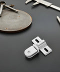 Heavy Duty Glass Shower Door Hinges Set Of 2 Alloy Pivot Hinges on a black surface with tools, frameless doors hardware.