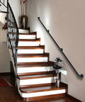 Heavy Duty Industrial Staircase Handrails Nine Feet Long Cut From Solid Galvanized Steel Pipe For Serious Corrosion Protection And Totally Hassle Free No Sweat Railing Setup At Home Today mounted on a wooden staircase.