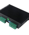 Front view of DM556 2-channel CNC stepper driver module with black heatsink and green terminal blocks