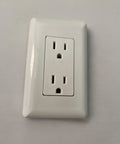 No Fuss White Duplex Electrical Wall Outlet With Grounded Three Prong Receptacle And Snazzy Beveled Cover Plate close-up view.
