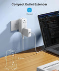 Super Sleek 4 Outlet Surge Protector With 360 Rotating Head And Space Saving Design White Power Strip Extender in use on desk.