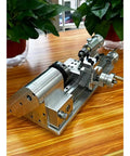 Compact Mini Metal Lathe For Benchtop Use With 3 Jaw Chuck And Tailstock, aluminum construction, precision design on wooden table.