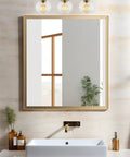 22 Inch Modern Three Light Vanity Bathroom Light With Clear Glass Globe Shades And Warm Brass Finish above bathroom mirror