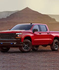 Front view of red Chevy Silverado 1500 with Blue Front Tow Hook Covers Set Of 2 For 2007 To 2024 Chevy Silverado 1500 Hitch Cover