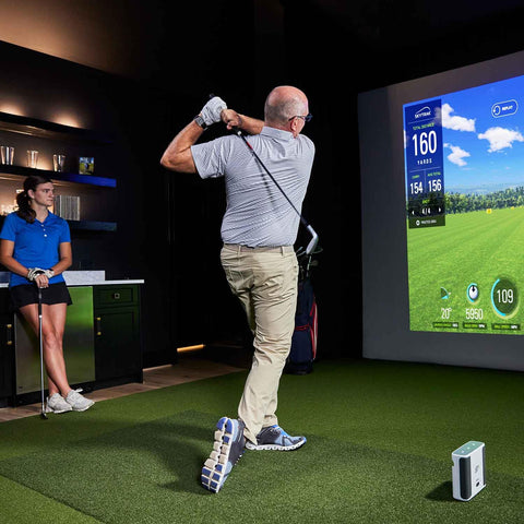 Launch Monitor And Golf Simulator Bundle With Dual Doppler Radar And 100K Courses for indoor practice, golfer swinging