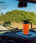 Road Ready Portable Car Electric Kettle Water Heater With Roomy 1000 Ml Stainless Steel Build shown in vehicle with scenic view.
