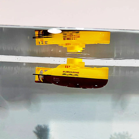 Mini RC Submarine Toy With Remote Control For Water Tank Play Dive Underwater Surface And Float Built In Battery USB Charger 15 Minute Run Time 15 X 6 Size Yellow Kids Birthday Gift floating in tank