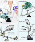 All In One Soldering Kit With 80W Adjustable Temperature Iron, Multimeter, Helping Hand, Desoldering Pump, Extra Tips, Solder Wire, Heat Shrink Tubing And Tape, Tweezers And Screwdriver For Pro Level Repairs showing helping hand tools and magnifier