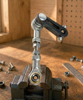 Rocker Arm Linkage Kit With Machined Metal Swing Arm Lever Slotted Arm And Circular Hole Connector Fish Eye Joint Set For DIY Projects And Mechanical Prototyping assembled in a vise