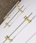 5 Pack Acrylic Cabinet Pulls With Brass Base Crystal Clear Glass Handles In Gold Finish installed on white cabinet doors