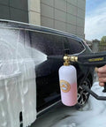 X-887 High Pressure Washer Gun With Foam Cannon Kit spraying foam on car, 5000 PSI, Brass Foam Lance Core, Easy Grip Handle visible