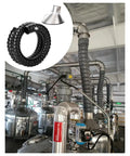 Top Tier Flexible Fume Extraction Arm With Wide Dust Removal Hood And Heat Proof Black Collection Hose Kit For Shop Smoke And Dust Management Setup 100 MM Bore in a factory setup.
