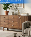 Walnut cabinet with silver round handles and decorative items, including plants and books on top