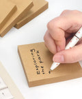 3x3 Self Stick Sticky Notes Set In 6 Bright Colors For Office School And Home, kraft note with handwriting next to keyboard