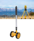 Glaeptio Dual 4in Rolling Measuring Wheel Accurate Distance Tool 0 to in outdoor setting with mountains in background.