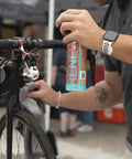Waterless Ceramic Bike Cleaner Spray With Pina Colada Scent, 16 Oz, Quick Post Ride Shine, Safe On All Finishes, No Water Needed, Easy Touchup For Road, Mountain, And Gravel Bikes applied to road bike bar