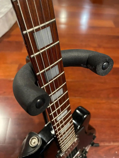 Black foam tubing on a guitar neck demonstrating use for Heavy Duty Foam Pipe Insulation Tubing Set With 1/4 Inch To 3-5/9 Inch ID