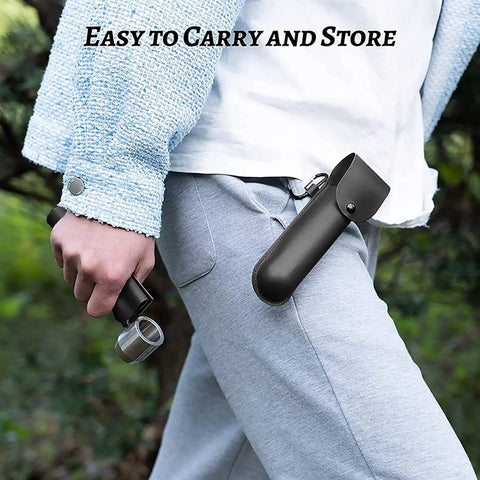 Person carrying Bushcraft Hand Auger Wrench With Flint Scotch Eye in leather case on belt loop, outdoors.