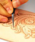 Close-up of hand using Leathercraft Modeling Tools Set Three Piece With S M L Sizes In Red PVC Pouch for precise carving.