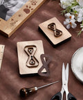 Leather Cutting Die Set 2 Piece 2 Styles With Wooden Die Molds Sharp Steel Blades Wallet Punching Dies And DIY Craft Stamping Tool On Smooth Wooden Base displayed with crafting tools