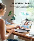 Woman using a laptop with 4K Auto Focus USB Web Cam With Dual Mics And Quick Privacy Flip Hella Crisp Video for meetings.