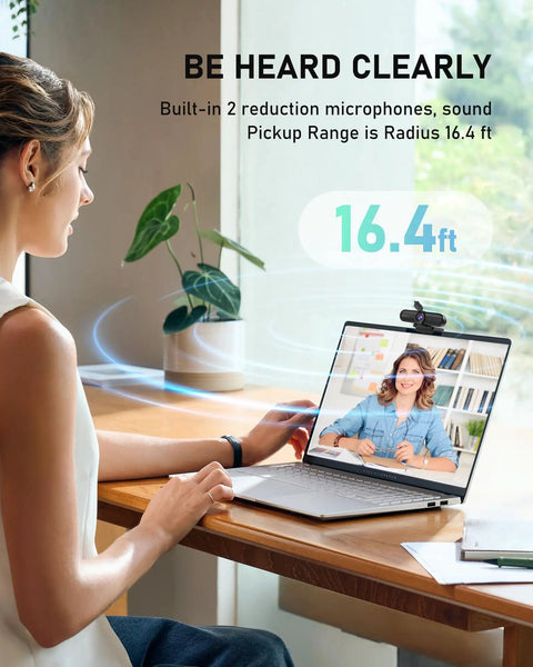 Woman using a laptop with 4K Auto Focus USB Web Cam With Dual Mics And Quick Privacy Flip Hella Crisp Video for meetings.
