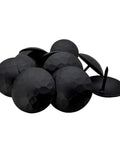 Top Shelf Matte Black Clavo Nails 50 Pack 1.5 Inch Decorative Studs scattered showing textured surface for upholstery and barn door use.