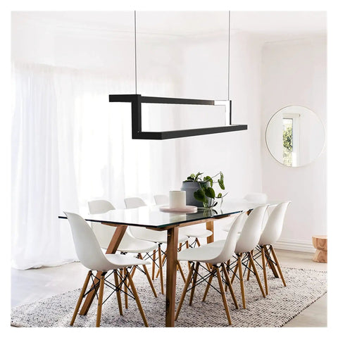 Modern LED Pendant Light for Dining Living Room Lustre Suspension Interior LED Pendant Lamp for Office Kitchen in black over a dining table.