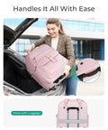 Woman lifting baby pink underseat carry-on luggage from car trunk