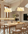 Pandaluna 15.75in Lantern Pendant Light, Wabi Sabi Faux Silk Hanging Lamp above wooden dining table.