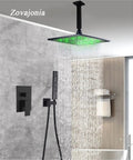 Dope LED Rain Shower System with 12 Inch Square Brass Rain Head, green LED light, ceiling mounted, black finish, bathroom setting.