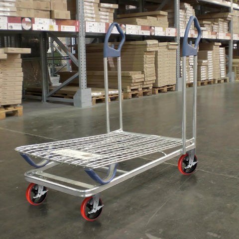 Heavy Hitter 8 Inch Industrial Casters Set Of Four on a platform cart with durable galvanized steel yokes and red polyurethane wheels.