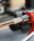 MT2 Cleaner For Wood Lathe Spindles inserted in a red lathe, showing wooden handle and measurement markings