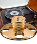 Gold metal Nobsound STB-01 LP vinyl turntable disc stabilizer weight, shown with a turntable in a zipper case.