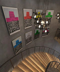 Spiral staircase with artwork on dark gray concrete walls in modern industrial style, illuminated by pendant lights.
