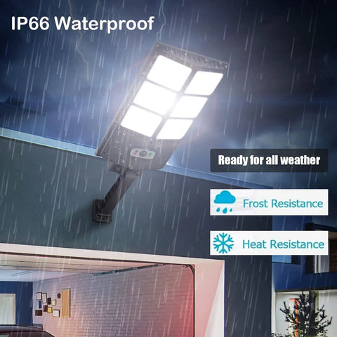 Hella Bright 150W Solar Flood Lights Outdoor With Motion Sensor 8000 LM To 12000 LM wall mounted during rain showing waterproof IP66
