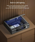 Portable Biometric Gun Safe With LED Light And Silent Mode open showing contents, on nightstand.