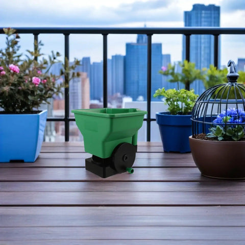 Green Handheld Seed Spreader And Planting Seeder For Veggies And Lawn Care Portable Hand Crank Broadcast Spreader Tool on balcony