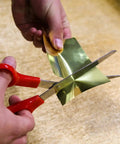 Cutting a brass sheet from the Assorted Brass Sheet Shim Set for Hobbyists and Model Builders, 24 Piece Kit of Easy Bend Brass Spacers.