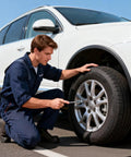 Man using 21 Piece Tire Repair Kit With Premium Spiral Screw In Plugs, Quick Puncture Fix In Minutes on a car tire